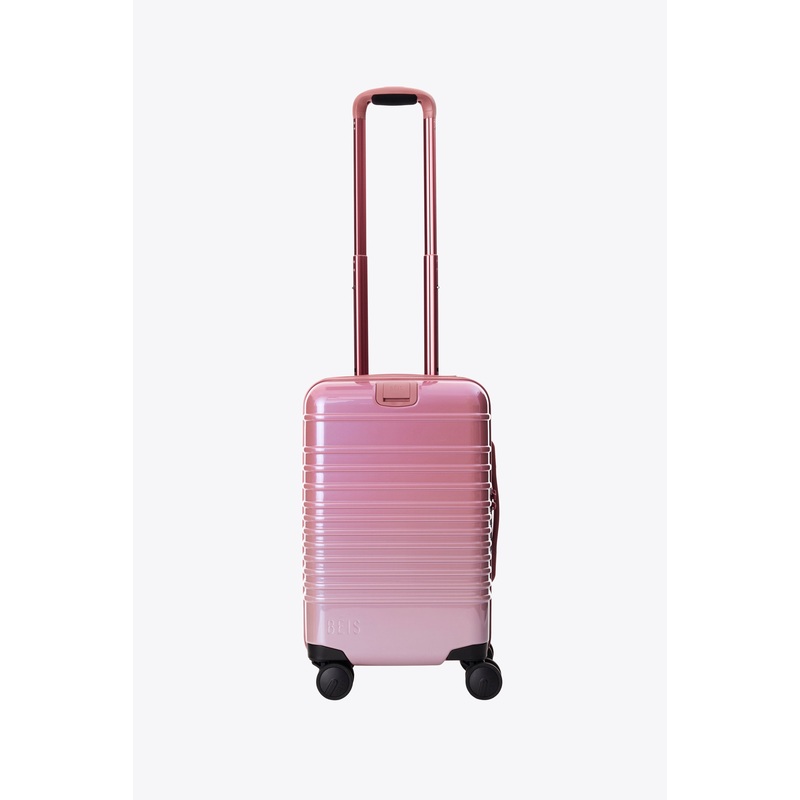 The Small Carry-On Roller in Wicked Pink